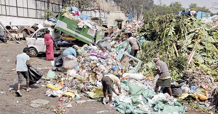 People wander near dustbins in search of black money