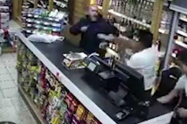 Indian-origin shopkeeper in UK fights off robber with vodka bottle, chair